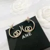 Boucles d'oreilles de cerceau de créateur de luxe pour femmes dores d'oreilles en or de bijoux Womans womans boucles d'oreille étouffe