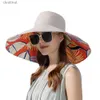 Breda randen hattar hink hattar kvinnor sommar dubbelsidig bred grim hatt solskydd Flower Beach Cap Lady Outdoor Elegant Sunscreen Headgear Wholesale Newl231221