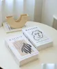 Objets décoratifs Figurines Luxury Table Book Book Boîte de rangement Faux modernes pour la décoration EdiblesGummies DHSZT8445918