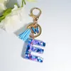 Porte-clés lettre avec cristal d'amour bleu pour femmes, pendentif de sac à main en résine scintillante, anneaux à pampilles papillon, bijoux cadeau