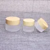 Gratis DHL Frosted Glass Cream Jar with Plastic Wood Grain Lock Makeup Skin Care Lotion Pot Hand Face Eyes Cream Bottle 5G-10G-15G-30G-50G Dlit