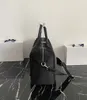 Sac à bagages de créateurs célèbres, sac de voyage, classique noir et à la mode nouveau sac à grande capacité, imperméable universel et résistant à l'usure pour les hommes et les femmes