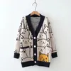 Femmes Jacquard Cat Loose Cardigan 2023 AUTTRE HIVER EN CORÉANT CORÉANT PLACH TIFEAUX AVEC POCKET CARTOON MOTEM 231221