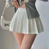 Rokken houzhou geplooide rok met shorts vrouwen sexy hoge taille onregelmatige witte zwarte A-lijn gyaru tennis mini rok school L231222