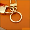 Llavero de llave del llavero de moda Diseñador de lujo Sier Gold Metal Hebilla Hebilla Classic Letter Pendse Keychains de alta calidad Mochila ORN DHFJI