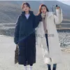 Women's Down Parkas 2023冬のパッド入りコットンコート女性新しい韓国語バージョンルーズロング膝の長さの女性の風の防風ウォームダウンジャケットアウターJ231222