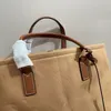 Nova sacola clássica de 4 cores, designer famoso, versátil, durável, de lona, para mulheres e homens, bolsa universal para encontros, compras, compras e turismo, 40 cm