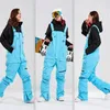 Winter Ski Men Pants Warm Bib vrouwen jumpsuit winddichte waterdichte overalls skiën snowboarden 231221