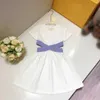 Klänningar 23SS Girls Dress Kids Designer Clothes Round Neck Pure Cotton Ribbon Splicing Bare midja Kort ärmklänning Big Girls High Quality