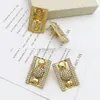 女性用のドバイイヤリングゴールドメッキイタリアの高級デザインネックレス長方形の形状合金ブレスレットリングセット231221
