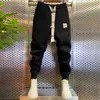 Męskie dżinsy Wysokiej jakości spodnie do joggera Numer Marka Mężczyzny Wtórne Mężczyźni spalanie solidnych kolorów swobodne spodnie dresowe haremowe spodnie J231222