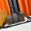 Womens Man Keepall 25 Bandouliere الكتف حقيبة Luxurys Tote Handbag Luggage Clutch Boston Bag Bag Top Handle Gym Crossbody Leather Pochete
