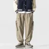 Pantalon masculin streetwear mode de causalité de causalité en liberté citadin japonais grandes vêtements de travail de travail occasionnels pantalon harem