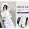 Kurtka damska w dół pucha do damskiej zimowej noszenia noszą nową białą, dużą futrzaną kołnierz Koreańską zagęszczoną i przedłużoną kurtkę na kolan