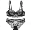 Bras europeu e americano Sexy Roupher Womens tra-fhin hollow sem esponja de renda transparente grande peito mostra pequeno conjunto de sutiãs de tamanho dro5n8