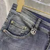 Designer Luxury maschi maschili Stampato lettera triangolare retrò nuovi jeans sciolte elasticità dritta usura pantaloni casual sport resistenti