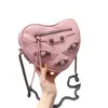 23 au début du printemps Nouvelle huile de cire locomotive Love en forme de sac de chaîne Mini Rivet One épaule Sac à bandoulière Mode féminine