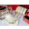 Merk mode -sieraden set voor dames goud vergulde rive stoom punk party mode botsing ontwerp oorbellen ketting armband ring223m