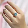 Cluster anneaux Style Luxury Couleur en argent imitation Rotundit Blue Topaz Open Ring pour femmes Fashion Modèle Unique Bijoux de motif polyvalent