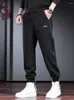 Pantaloni da uomo autunno pantaloni della tuta larghi neri uomini casual sport di moda sport elastico in giro per la vita dei pantaloni