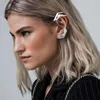 Pendientes de espaldas Y2K Clips de oreja Joya de moda Espina esquelética Ganchos alienígenas de moda para la generación moderna