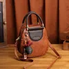 Neue echte Leder -Retro -Frauenbeutel, modische und personalisierte gewebte Handtasche, strukturierte Kuhläsesander -Schulter -Cross -Body -Tasche, Frauenpendelbeutel für die Arbeit