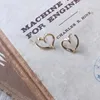 Stud -oorbellen creatieve piercing open schuine gedraaide hartvorm gouden legering meisjes vrouwen sieraden accessoires