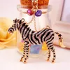 Animal Zebra Horse -Chain Chain Pingente Chave de Chaves de Chaves Acessórios para Esmalte de Esmalte de Óleo de Picão de Óleo de Oil Liga do Anel Mulheres Bolsa de Mulheres Charm217p