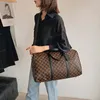 デザイナーファッション女性ダッフルバッグ高級男性女性旅行バッグレザーハンドバッグ