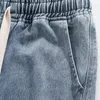 Jeans maschile foufurieux hip hop estate per pantaloni elastici della gamba a larga gamba rotta americana.