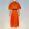 Vestido de diseñador con cuello de pie, cintura de un solo pecho, cintura con cintura, vestido largo de color sólido, manga de burbujas de moda, vestido de bordado hueco