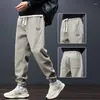 Pantaloni maschili autunno inverno kpop stile moda harajuku slim fit pantaloni sport scanghi tutti match di tasche per peluche casual badge