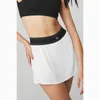 Shorts actifs Yoga Tennis Robe courte courte confortable Anti-slip nue Sentiment rapide Sèche Sports décontractés en vrac avec des poches