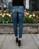 Moda Mediados de cintura Jeans ajustados Mujeres Vintage Pantalones de mezclilla desgastados Otoño Prensado Destruido Lápiz Casual Ripped 231225