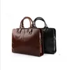 Bolsas para computadoras portátiles de maletín de cuero para hombres bolsos de hombro suave hombre de negocios bacos de mano masculino mordiscos formales236k