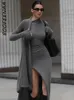 Boofeenaa asymmetrisch stricken langen Kleidern für Frauen Winter Mode Kendall Outfits graue schwarze sexy Ärmelschlitzkleider