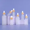 Hot Sale Portable Bamboo Lids Clear 5-100ml Bottle Empty Glass Dropper Bottles For Essential Oils Makeup Oil Fjiuo