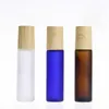 5 ml 10 ml bouteilles à rouleaux en verre bleu clair grosé pour huile essentielle avec balle SS et casquette en plastique de grain de bois 650pcs / lot Vedwi