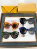 Okulary przeciwsłoneczne dla kobiet mężczyzn Słońca Słoneczne styl mody chroni oczy Oczy Uv400 z losowym pudełkiem i obudową 40127
