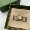 Modedesigner Magritte Ring Golden Flower Mönster älskar lyxringar Blue Diamond Womens smycken män som lyser brev med låda