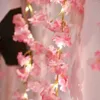 Stringhe 1PC Cherry Blossom String Light 20LED Ghirlanda Viti di fiori artificiali Lucine per la decorazione della festa nuziale della camera da letto