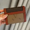 Mini authentique cuir brun classique masque femme portefeuille porte-monnaie