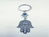 Mode smycken ängelvingar onda ögon hamsa fatima hand charm diy nyckelring