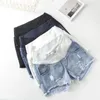 Gonne 2020 Pantaloncini da donna incinte Abbigliamento estivo Pantaloncini di jeans a vita bassa Abbigliamento estivo Nuova primavera Pantaloni larghi per i vestiti delle donne incinte