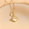 Colliers pendentifs Nouveau gland oeil de chat collier en acier titane pendentif en diamant coeur de pêche pour femmes avec chaîne de collier minimaliste