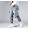 Dżinsy męskie Hip Hop Men Workowate deskorolki Spodnie Hiphop Loose Boys Multi-Papies Dżinsowe spodnie Four Seasons Plus Size 44