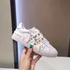 Unisex Designer Casual Shoes White Shoes with Metal Rivet Lacquer Leather Graffiti Heart Couples Shoes