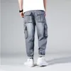 Dżinsy męskie Hip Hop Men Workowate deskorolki Spodnie Hiphop Loose Boys Multi-Papies Dżinsowe spodnie Four Seasons Plus Size 44