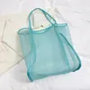 Bolsas de compras 2023 Ins Wind Malla transparente Bolso de un solo hombro Moda Ligero All-Match Red de playa para mujer