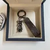 Designer di portachiavi in ​​pelle Black Metal Key Bear e Keychain Airseshoe Amante Auto Torchia fatto a mano Uomini da donna Accessori a ciondolo a ciondolo